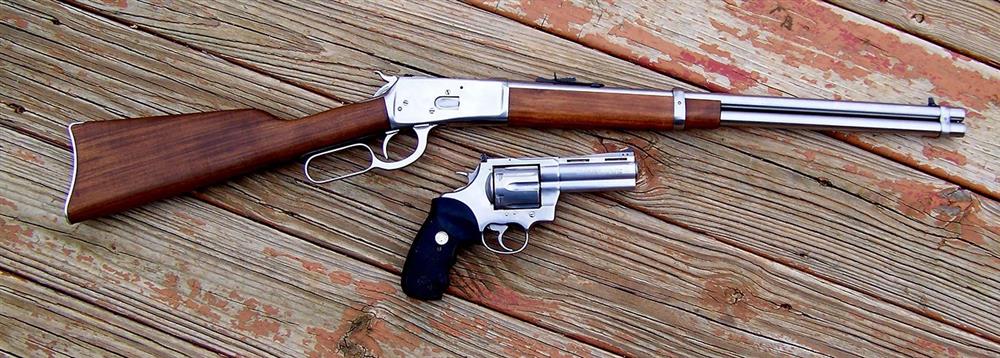 Levr action rifle and revolver both chambered for .45 Colt